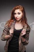 young girl in a leather jacket represents model