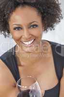 mixed race african american girl drinking red wine