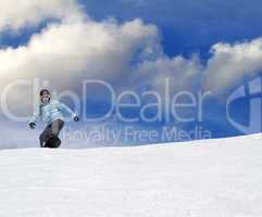 snowboarder on ski slope at nice day
