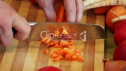 time lapse of a chopped carrot on a wooden board