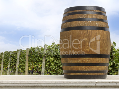 wine barrel in front of the vineyard