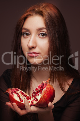 portrait of young girl with pomegranate