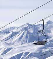 chair lifts and off piste slope in fog