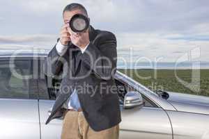 man standing in front of the car and photographed