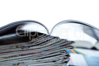 stack of newspapers, magazine, and keyboard close-up