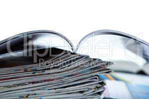 stack of newspapers, magazine, and keyboard close-up