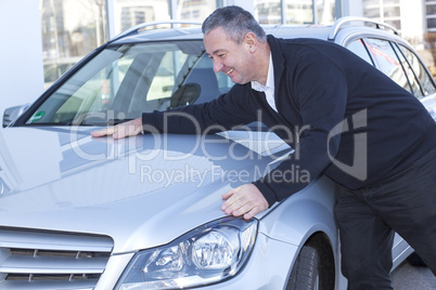 man is pleased with his car