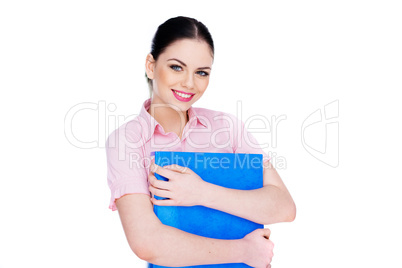 young woman smiling while holding a blue folder