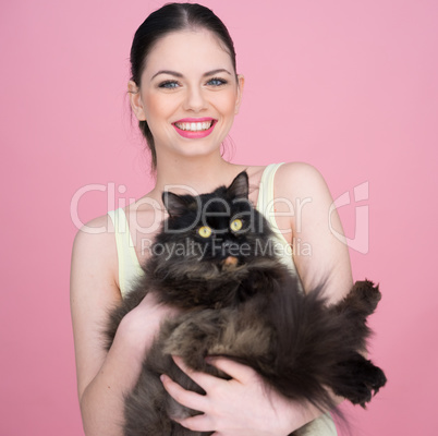 beautiful woman holding a big black cat