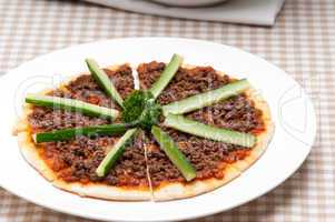 turkish beef pizza with cucumber on top