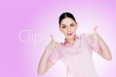 successful young woman giving a thumbs up