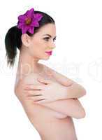 exotic naked young woman with a flower in her hair