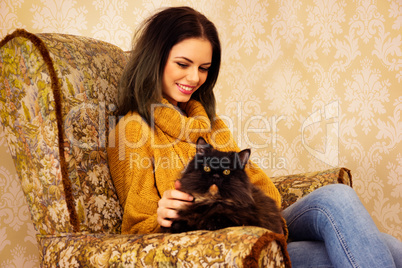 beautiful young woman with her fluffy cat