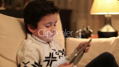 cute kid using tablet computer