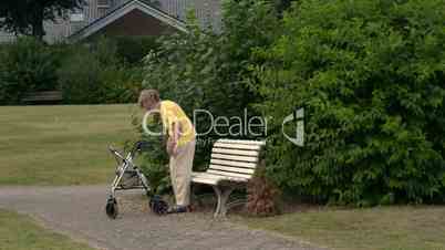 pensioner sit down painfully on park bench 11085