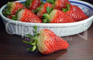 Fresh strawberries in white colored font