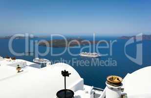 cruise ship near volcano on island of Santorini