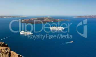 cruise ship near volcano on island of Santorini