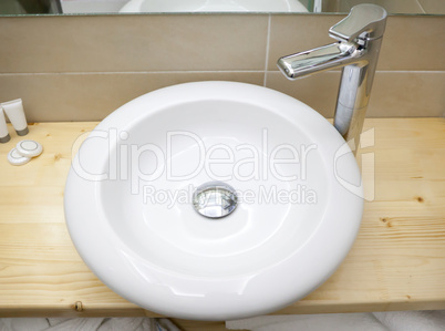 Round white sink in modern bathroom