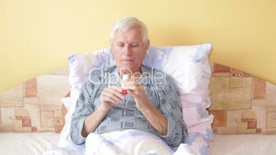 Senior man with asthma inhaler