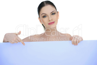 beautiful woman pointing to a blank sign