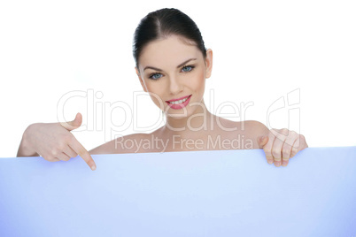 beautiful woman pointing to a blank sign