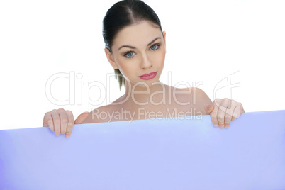 beautiful woman pointing to a blank sign