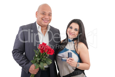 couple holding ring and flowers isolated.  anniversary and engag