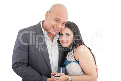 happy couple holding a box with a ring isolated