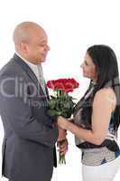 happy couple holding a bouquet of red roses isolated