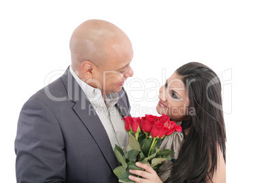 man giving a bouquet of red roses to his pretty girlfriend