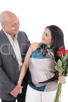 happy smiling woman with bouquet of roses holding her boyfriend