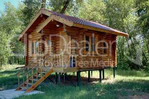 The wooden house with a porch.