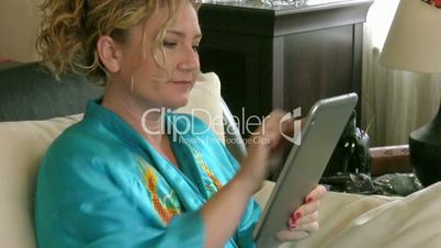 Woman using digital tablet computer PC and drinking coffee