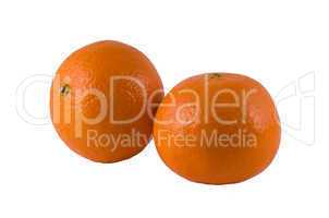 two ripe oranges on a white background