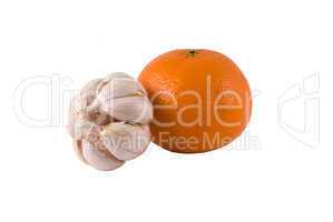 garlic and ripe orange on a light background