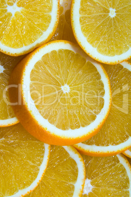 background the juicy orange cut by round segments