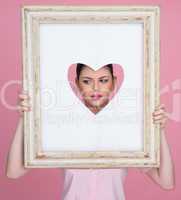 beautiful woman with her face framed by a heart