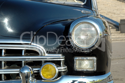 The right headlight of the old automobile