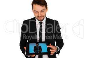 businessman showing a self-portrait on a tablet