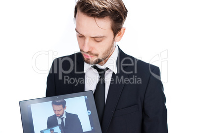 man displaying a handheld tablet computer