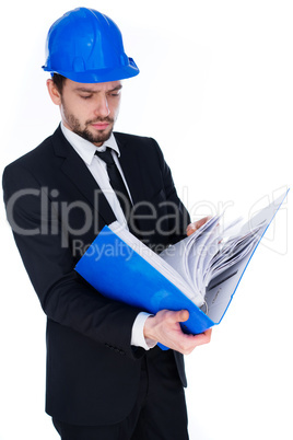 architect consulting a binder of notes