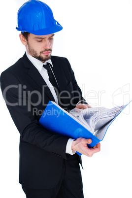 architect consulting a binder of notes