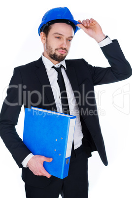 young architect raising his hardhat in greeting