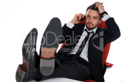 worried businessman chatting on his mobile