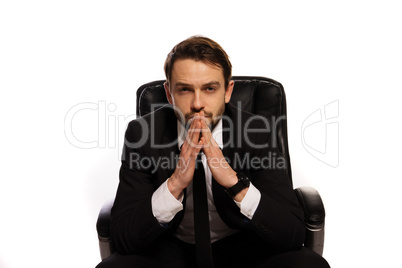 thoughtful boss sitting at his desk