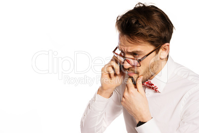 nerdy businessman talking on a smartphone