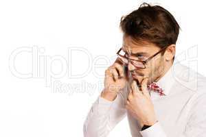 nerdy businessman talking on a smartphone