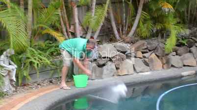 A Man Salts Swimming Pool