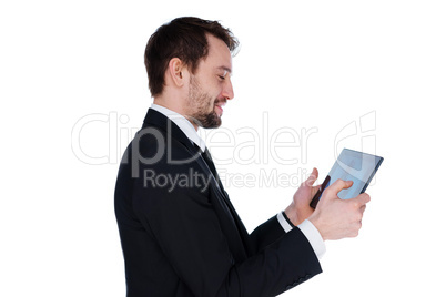 smiling businessman looking at his tablet-pc